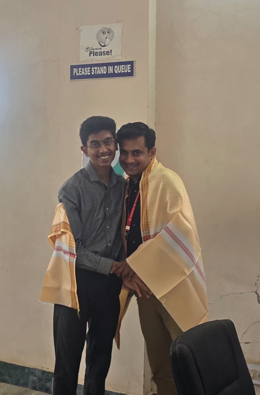 Saatvik Karthikeyan with Prof. Anfinston, Dean of Exams / COE, Achariya College of Engineering & Technology